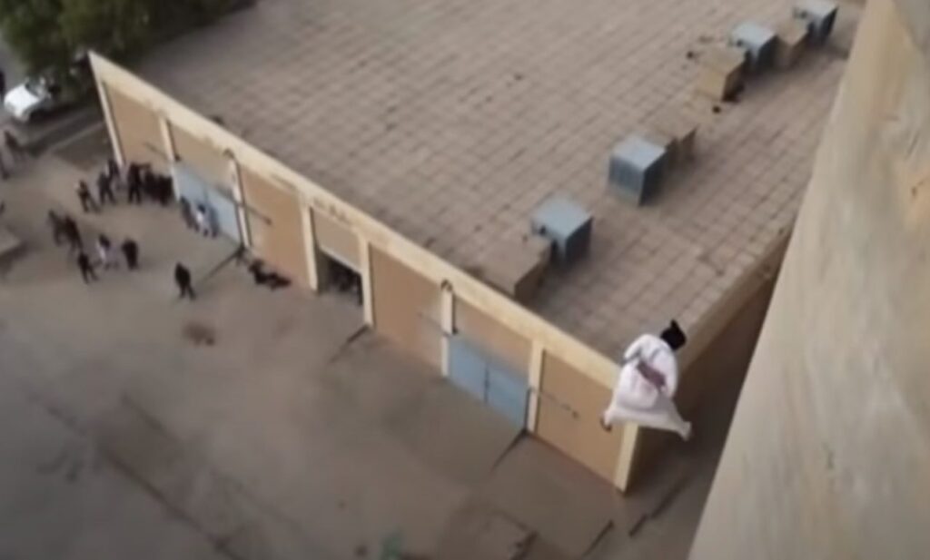 Top view of man in mid air moments from hitting the ground.