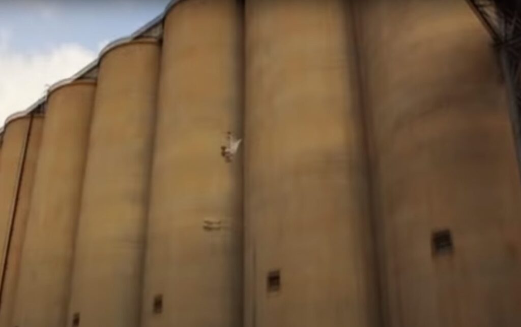 Bottom View of Man tumbling through  the air from a great height